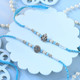 Ganesha & Om Rakhi Premium Sweet with Rocher Gift Combo