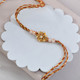 Traditional Golden Flower Rakhi With Almond & Ferrero