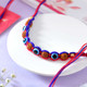 Evil Eye Protection Rudraksha Rakhi with Kaju Katli & Snickers
