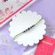 Elegant Green Thread Beads Rakhi