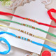 Hand Braided Colorful Rakhi Set With Kaju Katli