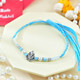 Religious Ganesha And Suriya Dev Rakhi Set