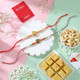 Set of 2 Floral Design Rakhis with Gourmet Hamper