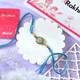 Floral Shaped Rakhi With Blue Thread