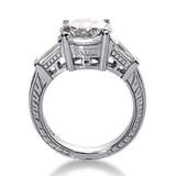Antique estate style engraved 2.5 carat round and baguette lab grown diamond alternative cubic zirconia engagement ring in platinum.