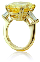 Chateau 15 carat oval baguette lab created cubic zirconia solitaire engagement ring in 14k yellow gold.
