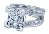 Omega emerald radiant cut lab grown diamond alternative cubic zirconia pave set round ring in 14k white gold.