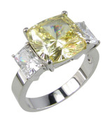 Lena canary cushion cut and emerald radiant cut lab grown diamond simulant cubic zirconia three stone ring in 14k white gold.