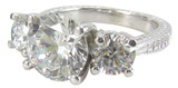 Engraved 3.5 carat lab grown diamond simulant cubic zirconia round three stone anniversary antique ring in platinum.