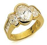 Oval Splendor 2.5 carat three stone laboratory grown diamond simulant cubic zirconia baguette engagement ring in 14k yellow gold.