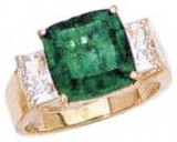 Tsoler 5.5 carat cushion cut with emerald cut lab grown diamond simulant cubic zirconia side stones in 14k yellow gold.