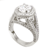 TomKat 2.5 carat oval laboratory grown diamond alternative cubic zirconia pave halo split shank solitaire engagement ring in platinum.