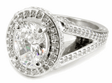 TomKat 1.5 carat oval laboratory grown diamond alternative cubic zirconia pave halo split shank solitaire engagement ring in platinum.