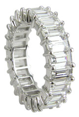Emerald step cut or radiant cut prong set lab grown diamond look cubic zirconia eternity band in 14k white gold.