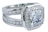 Ektiar 2.5 carat princess cut lab grown diamond alternative cubic zirconia pave set round halo split shank solitaire in 14k white gold.
