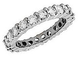 Small 2.5mm each round laboratory grown diamond look cubic zirconia shared prong set eternity band 14k white gold.