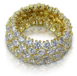 Flexible prong set round lab-grown diamond alternative cubic zirconia eternity wedding band in 14k yellow gold.