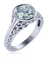 Round 1.5 carat bezel set lab grown diamond look cubic zirconia engraved antique estate styled ring in 14k white gold.