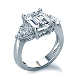 Emerald Step Cut 2.5 Carat Heart Three Stone Ring with lab grown simulated diamond quality cubic zirconia in 14k white gold.