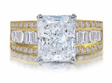 Tahleen 4 carat emerald radiant cut lab created cubic zirconia baguette solitaire engagement ring in 14k yellow gold.