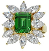 Emerald cut 2.5 carat step cut and marquise lab grown cubic zirconia cluster ballerina ring in 14k gold.