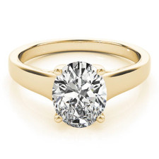 Luccia 1.5 Carat Oval Lab Grown Diamond Alternative Cubic Zirconia Trellis Setting Solitaire Engagement Ring in 14k yellow gold.