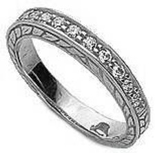 Engraved pave set round lab grown diamond simulant cubic zirconia anniversary band in 14k white gold. Engraved pave set round lab grown diamond simulant cubic zirconia anniversary band in 14k white gold.