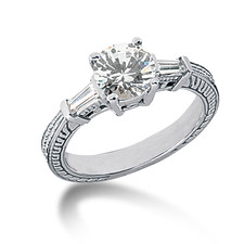 Antique estate style engraved 1.25 carat round and baguette lab created cubic zirconia engagement ring in 14k white gold.