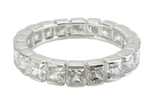 Princetta princess cut semi bezel set lab grown diamond quality cubic zirconia eternity band in 14k gold.