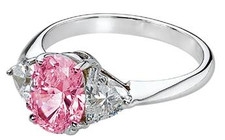 Legally Blonde 2 style 2.5 carat pink oval lab grown diamond alternative cubic zirconia trillion solitaire engagement ring in 14k white gold.