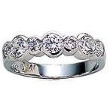Bezel set round lab grown diamond look cubic zirconia anniversary band in 14k white gold.