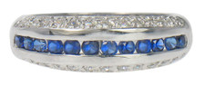 Channel set round lab grown diamond look cubic zirconia pave anniversary band in 14k gold or platinum.