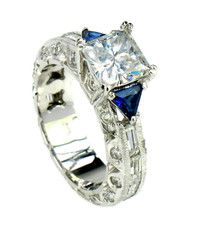 1.5 carat princess cut and trillion laboratory grown diamond simulant cubic zirconia engagement ring in 14k white gold.