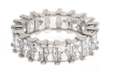 Emerald radiant cut lab grown diamond alternative cubic zirconia shared prong set eternity band in 14k white gold.