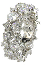 Round lab grown cubic zirconia prong set garland cluster eternity band in 14k white gold.