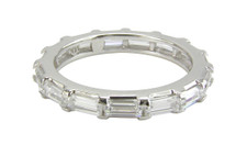 Horizontal east west baguette shared prong lab grown diamond simulant cubic zirconia eternity wedding band in 14k gold.