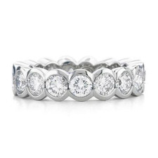 Semi bezel set round lab created cubic zirconia eternity band in 14k white gold, 14k yellow gold and platinum.