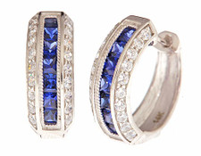 Sigma Hoop Earrings with man made sapphire and lab grown diamond look cubic zirconia in 14k yellow gold. Sigma Hoop Earrings with man made sapphire and lab grown diamond look cubic zirconia in 14k yellow gold.