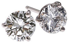 Three prong 1 carat each round lab grown diamond look cubic zirconia stud earrings set in 14k white gold.