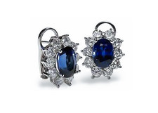 Oval 2.5 carat each lab created sapphire and cubic zirconia cluster earrings in 14k white gold.
