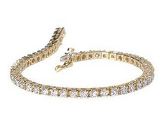 Round Prong Set Tennis Bracelet with simulated laboratory grown diamond alternative cubic zirconia in 14k yellow gold.