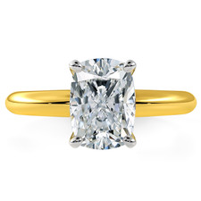 Elongated cushion cut lab grown diamond look alternative cubic zirconia solitaire engagement ring in 14k yellow gold.