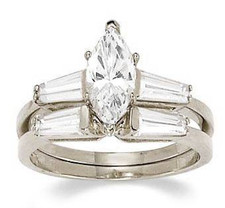 Marquise cubic zirconia baguette solitaire engagement ring with matching wedding band in 14k white gold.