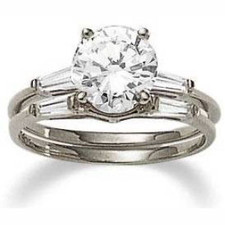 Round laboratory grown diamond look cubic zirconia baguette solitaire with matching wedding band in 14k white gold.