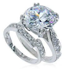 Round 5.5 carat lab grown diamond alternative cubic zirconia cathedral pave bridal set in 14k white gold. Round 5.5 carat lab grown diamond alternative cubic zirconia cathedral pave bridal set in 14k white gold.