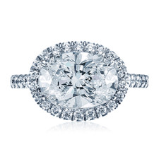 Horizontal oval halo pave ring with lab grown diamond simulant cubic zirconia in 14k white gold.
