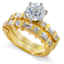 Alternating 1.5 Carat Round and Baguette Channel Bridal Set with lab grown diamond look cubic zirconia in 14k yellow gold.