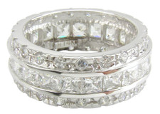 Princess cut and round lab grown diamond simulated cubic zirconia channel set eternity band in 14k white gold.