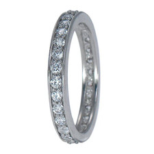 Round shared prong laboratory grown diamond look cubic zirconia eternity band in 14k white gold.
