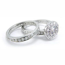 Round .75 carat bezel halo lab grown diamond simulant cubic zirconia solitaire bridal set in platinum.